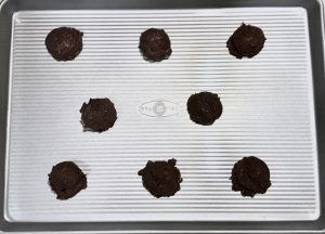 Brownie cookie dough on cookie sheet