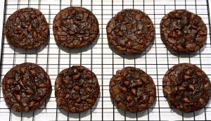 Baked brownie cookies on cooling rack