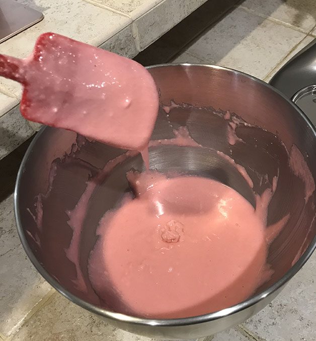 Pink macaron mix in mixing bowl