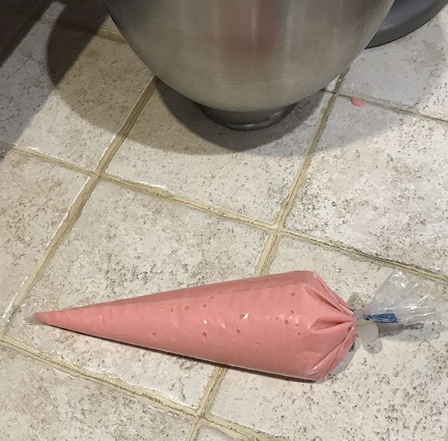 Piping bag with pink macaron mix