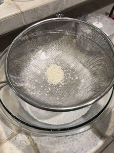 Leftover almond flour grounds in sifter